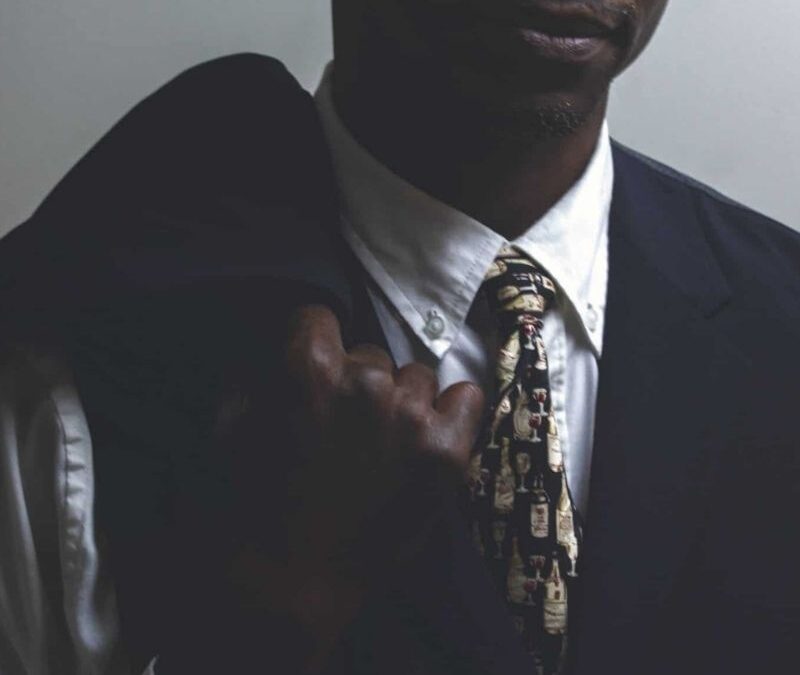 Black man in a picture wearing a suit